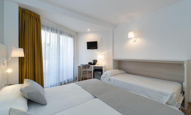 Habitación Doble (2 adultos + 1 niño) · foto 7