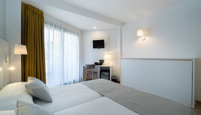 Habitación Doble (2 adultos + 1 niño) · foto 1