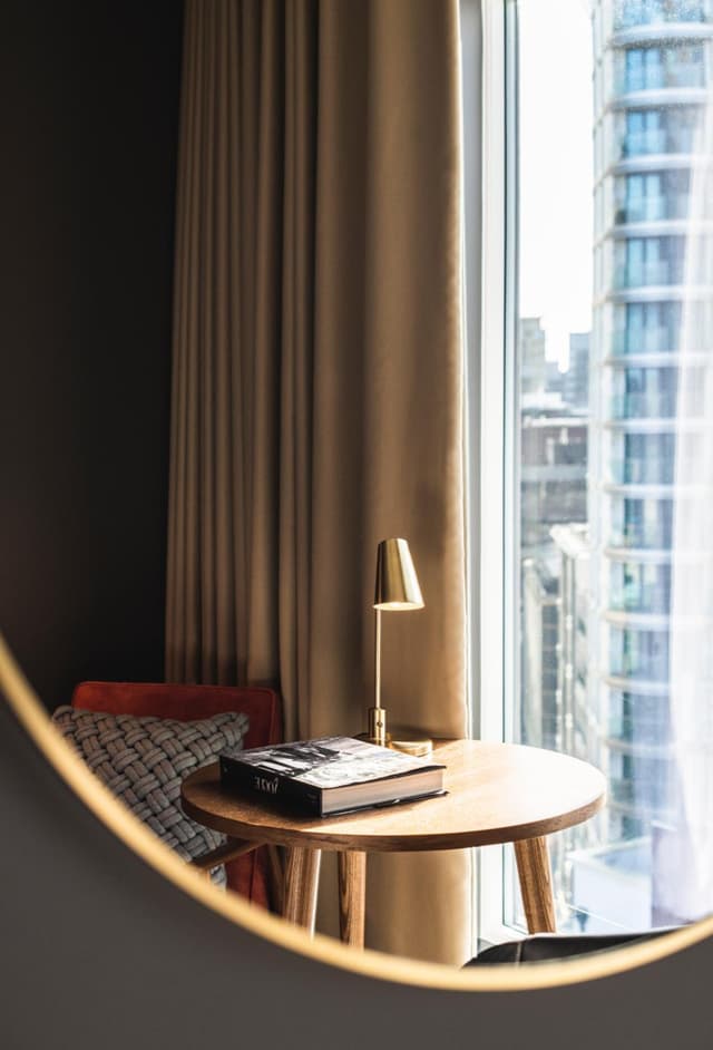 small round table with a book on top of it