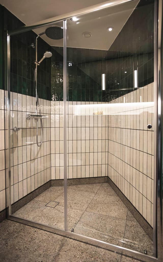 walk - in shower with tiled walls and flooring