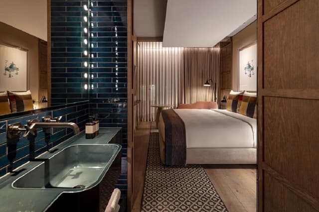 hotel room with a bed and a sink in it
