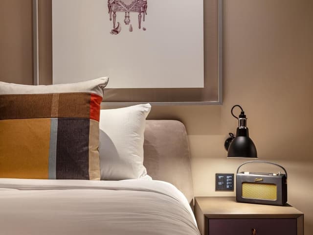 drawing of a zebra on the wall above the bed