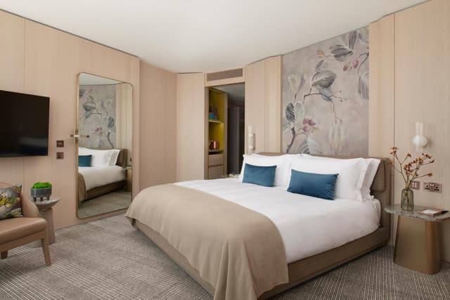 bedroom with a large bed and a flat screen tv