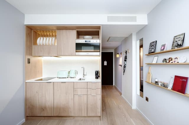 kitchen with light wood cabinets and a white countertop