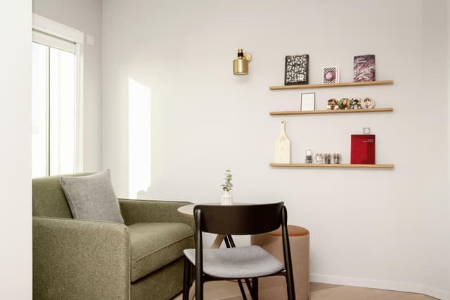 chair and a table in the corner of a room