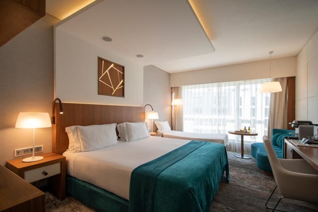 Deluxe Double Room with Extra Bed (2 Adults + 1 child up to 12 years old) · photo 1