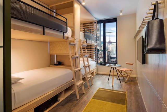 Room with Two Sets of Bunk Beds and Roll-In Shower - Mobility Access · photo 4