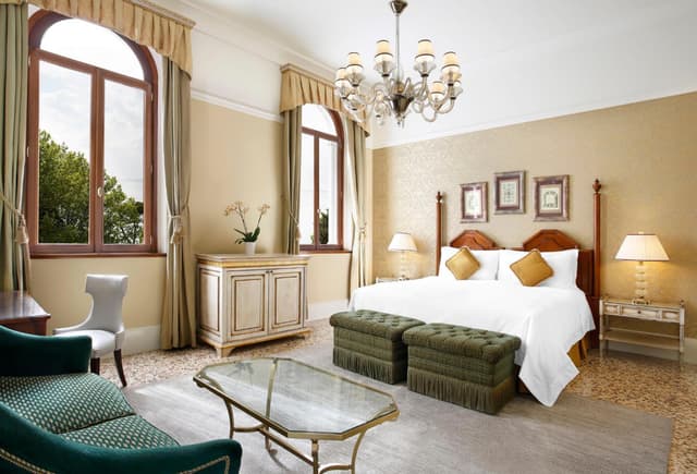 hotel room with a king size bed and sitting area