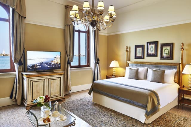 hotel room with a large bed and a flat screen tv