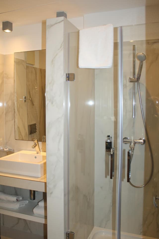 Relax in luxury in this modern marble retreat.