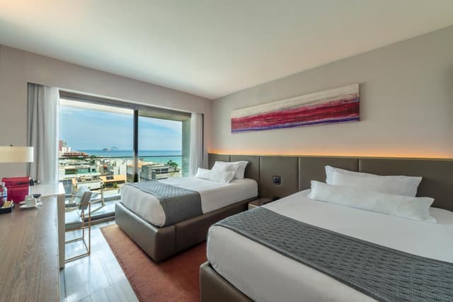 Habitación Doble Deluxe con Vista Lateral al Mar · foto 1