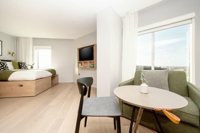 room with a couch and a small table in it