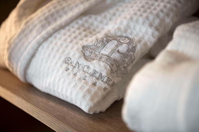 close up of a bathrobe and some towels