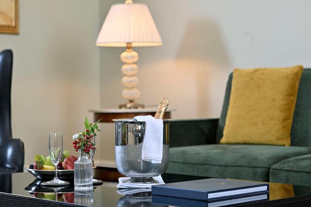 living room with a green couch and a coffee table