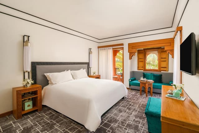 Deluxe Room with Balcony and Pool View · photo 1