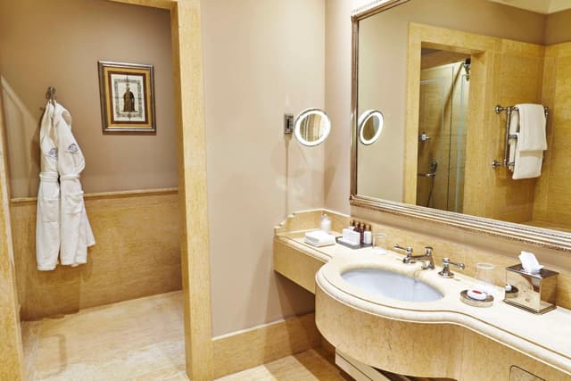 bathroom with two sinks and a walk - in shower