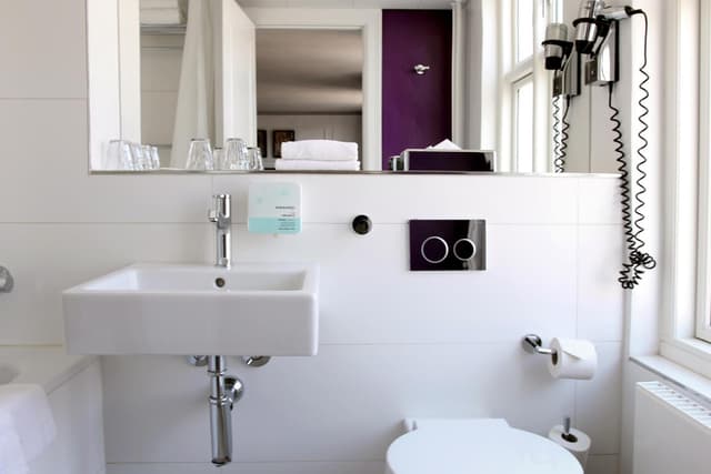 Experience modern comfort in our stylish bathrooms!
