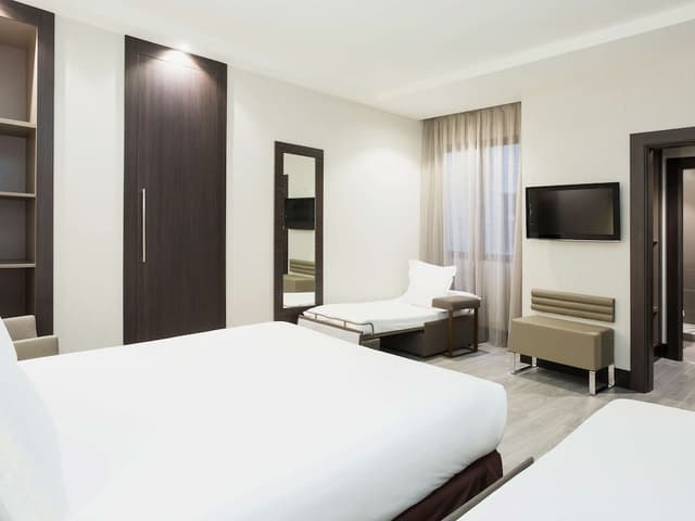 Standard Room with one Queen bed and two child beds · foto 4